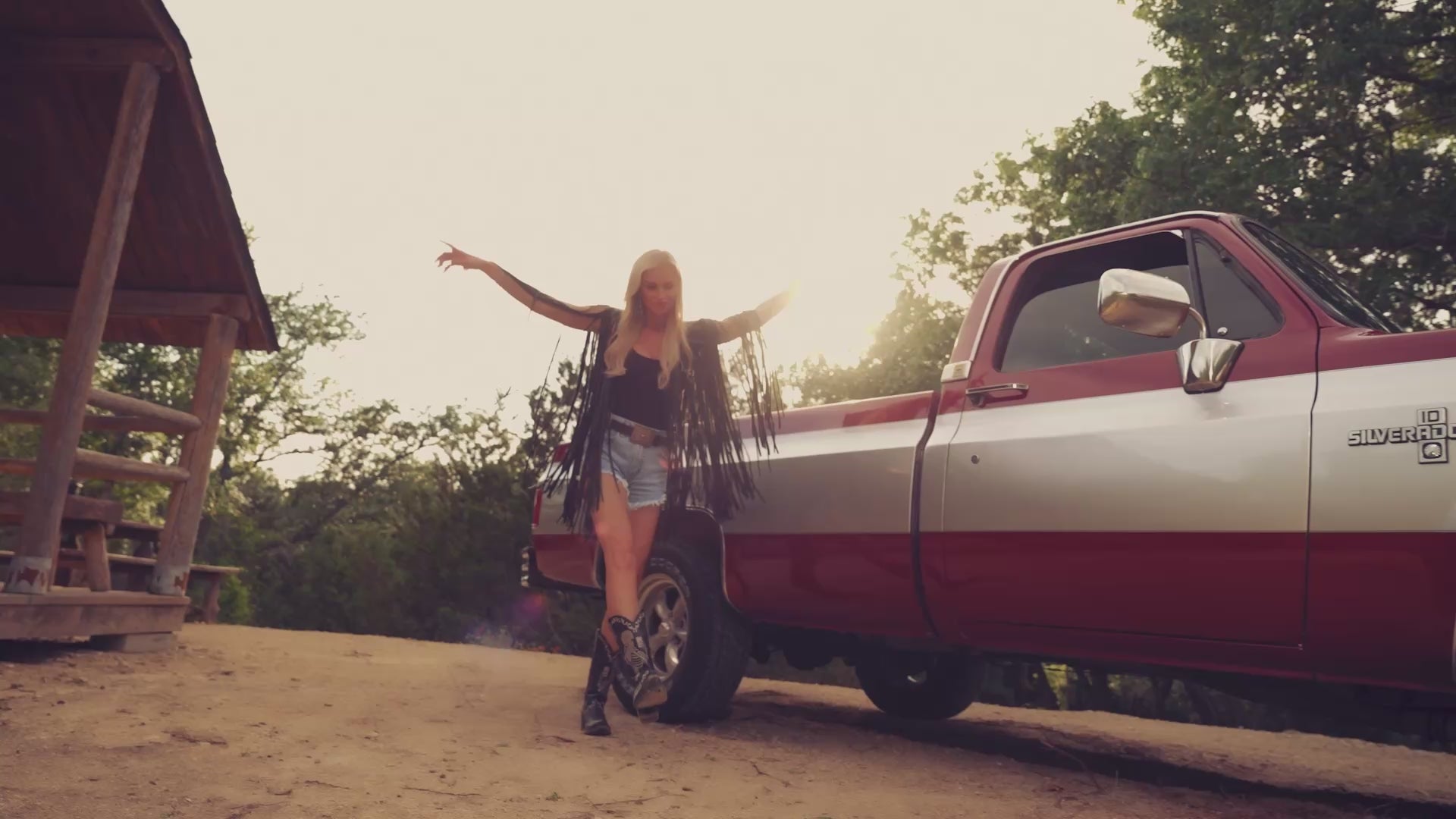 Short video clip of Tara in front of a truck dancing
